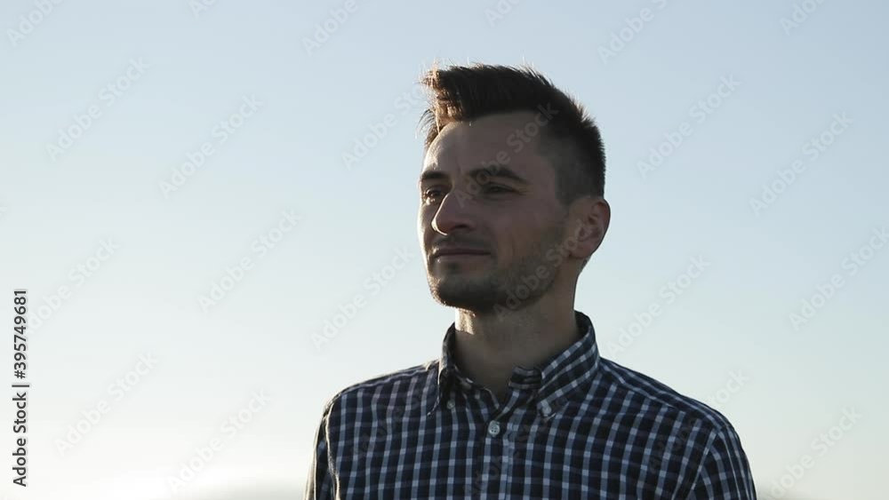 Close-up portrait of young handsome standing outdoors. Concept of people emotions. Attractive Man with Beard Enjoying Successful Lifestyle. Handsome Man Standing Alone in Park Outside. Close-up portrait of young handsome standing outdoors. Concept of people emotions. Attractive Man with Beard Enjoying Successful Lifestyle. Handsome Man Standing Alone in Park Outside.