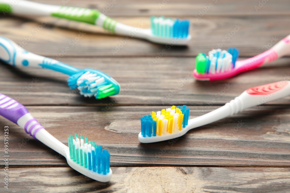 Toothbrushes on a brown background. Top view Toothbrushes on a brown background. Top view