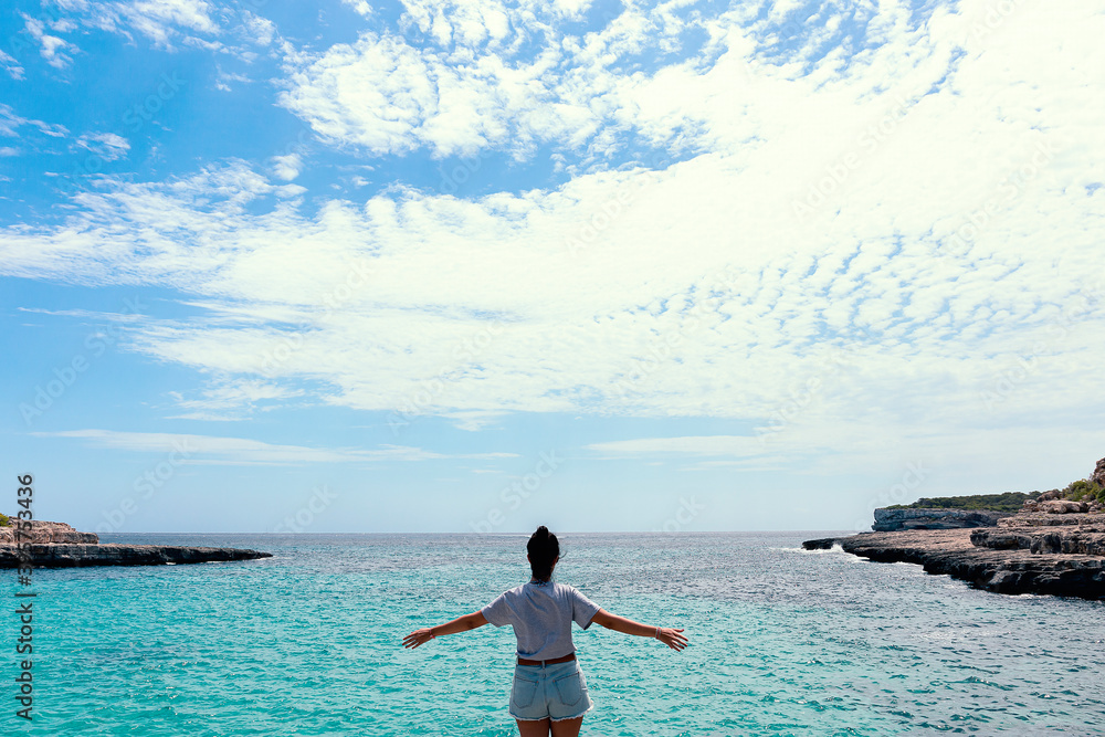 Woman from behind looking at sea