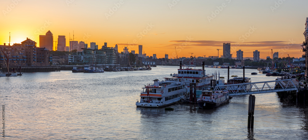 London - The ships in the pier and the Canary Wharf in morning.