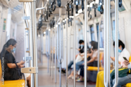 Photography The Environment of Asia passengers inside the Sky Train with the masks on all people's faces