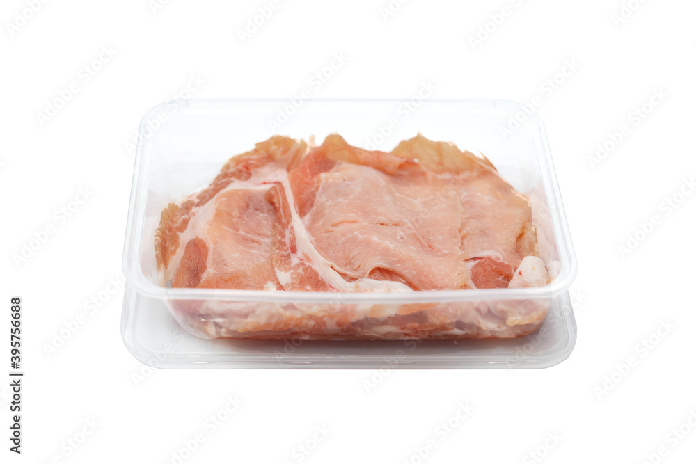 fresh Sliced raw pork in plastic box on white clear background. fresh Sliced raw pork in plastic box on white clear background.