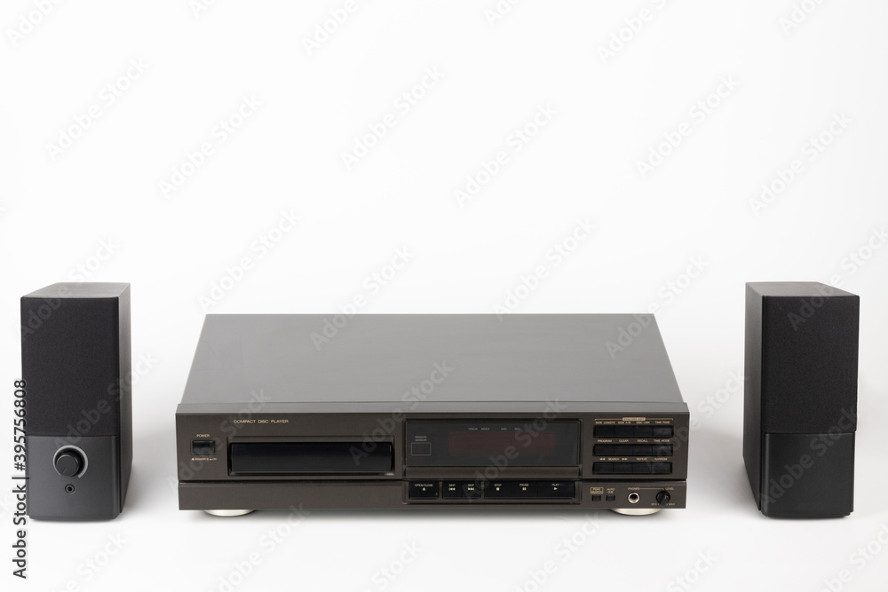 CD Player Stereo Hi-fi and two stereo speakers. High-end audio equipment on white background. CD Player Stereo Hi-fi and two stereo speakers. High-end audio equipment on white background.