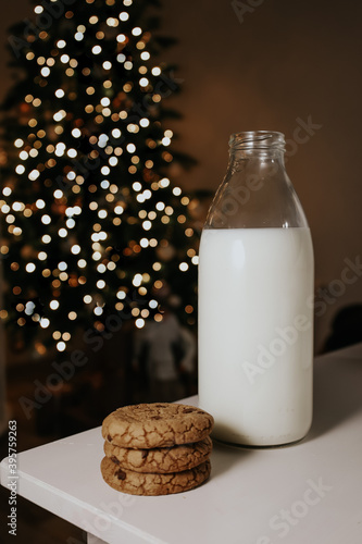 A bottle of milk on a white table in a new year's evening atmosphere