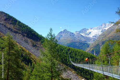 Charles Kuonen suspension bridge in Swiss Alps. With 494 metres, it is the longest suspension bridge in the world. Valais, Switzerland