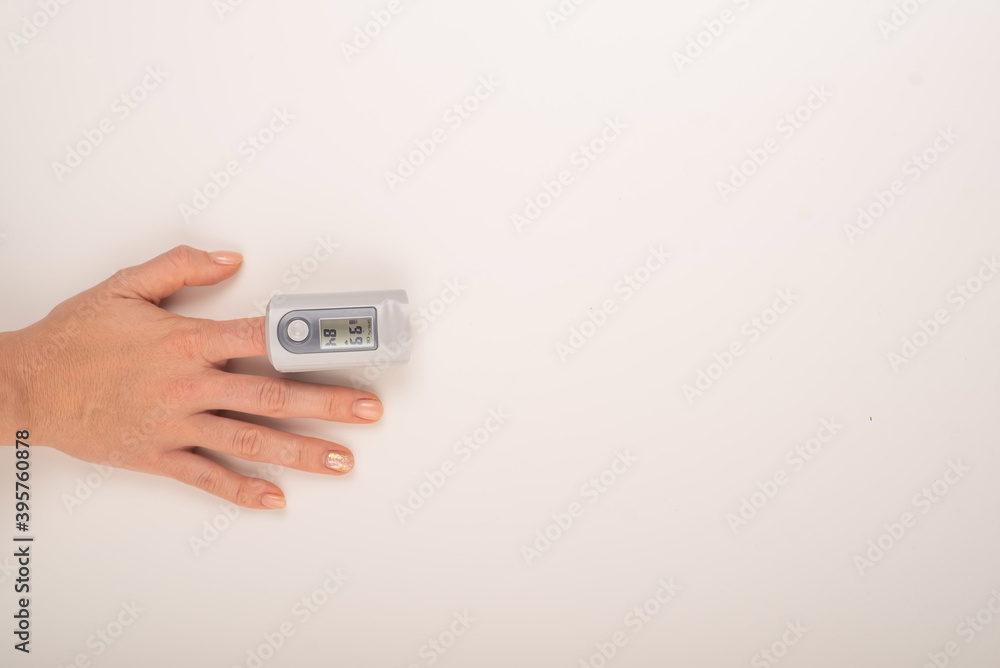 Female hand with a measuring device saturation. Blood oxygen level in coronavirus Female hand with a measuring device saturation. Blood oxygen level in coronavirus