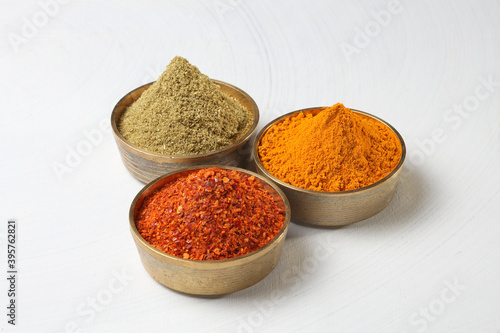 different spices in a metal bowl.