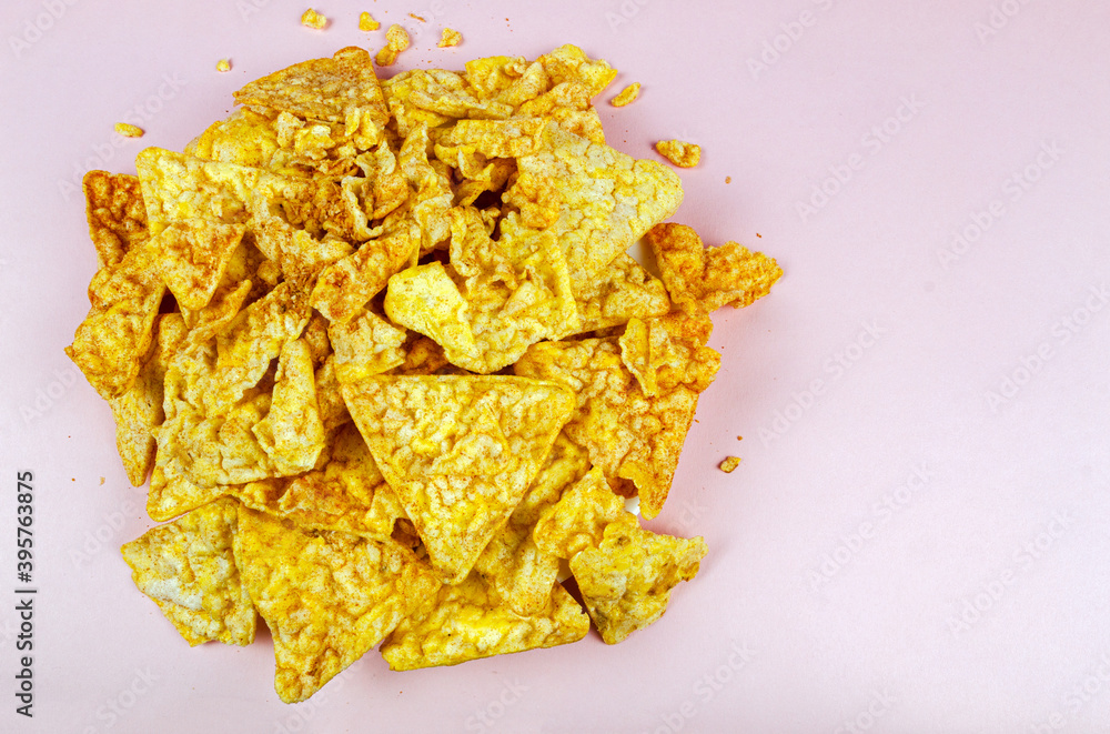 corn crumbs on a pink background