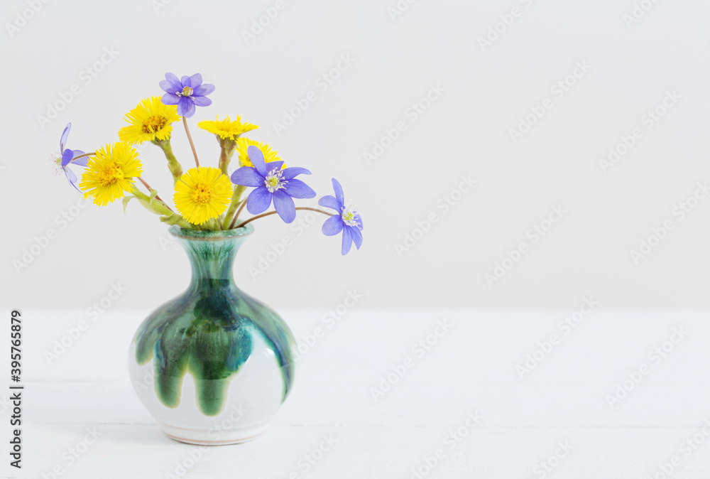 spring flowers in vase on white background spring flowers in vase on white background