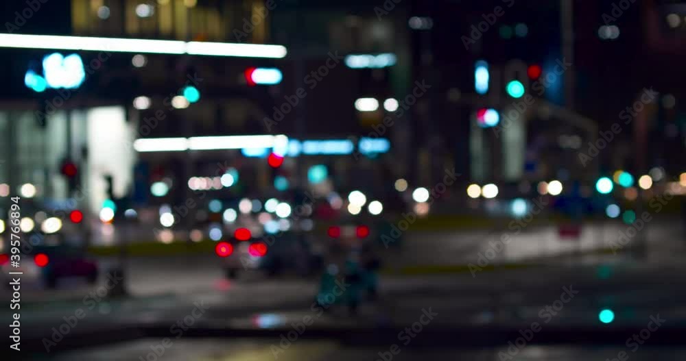 Urban transport in defocus at night. Bokeh of cars and traffic lights at night. Bokeh of City Night Traffic. Round colorful bokeh shine from car lights in traffic jam on city street. Urban transport in defocus at night. Bokeh of cars and traffic lights at night. Bokeh of City Night Traffic. Round colorful bokeh shine from car lights in traffic jam on city street.