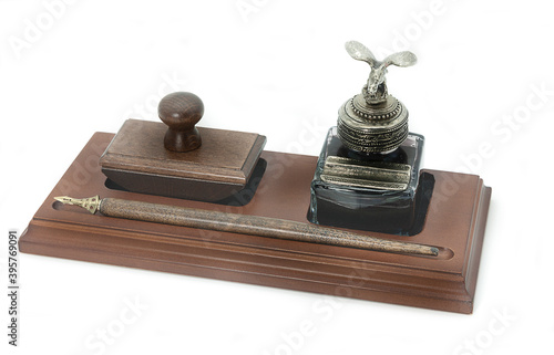 Obraz na plátně writing set pen inkwell and paperweight on white background