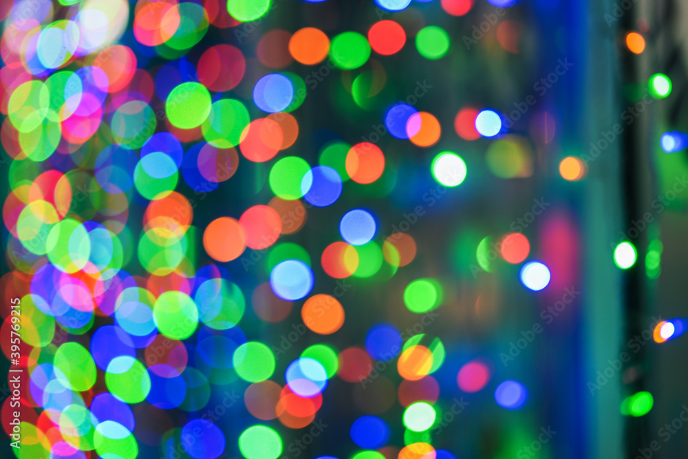 Christmas background. Green, red and blue lights. Bright blurred bokeh