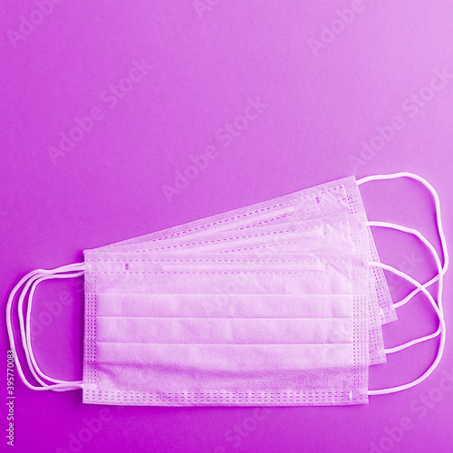 Medical mask protective virus, flu, disease. Isolated on a lilac background.