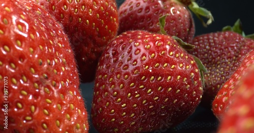 Macro shot of large Strawberries. Strawberry seeds. Shot with Calyx. Strawberries close-up. 