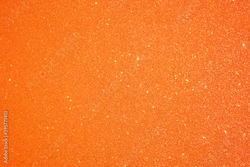 Orange Glitter background. Christmas and Valentines abstract texture.