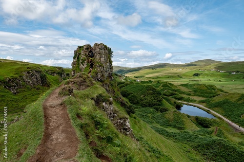 The rocks of Faerie Castle (Castle Ewen) at the Fairy Glen in Isle of Skye in Scotland with a muddy path photo