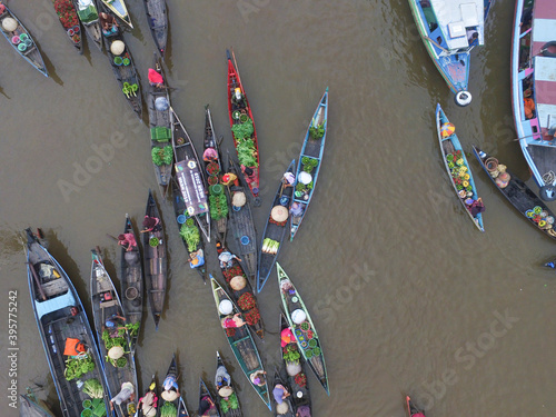  Banjarmasin Indonesia November 27, 2020 : Famous floating market in Indonesia, Lok Baintan floating market, tourists visiting by boat. Aerial Traditional Floating Market in Indonesia