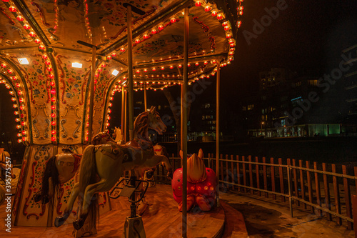 Fonte Nova's garden with Christmas market and colored ferris wheel near Ria de Aveiro at night