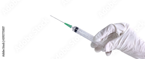 hand holding a syringe with needle isolated on white background