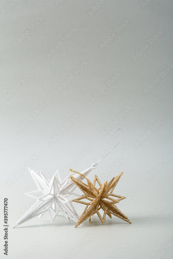 White and golden Christmas stars o gray surface, copy space White and golden Christmas stars o gray surface, copy space
