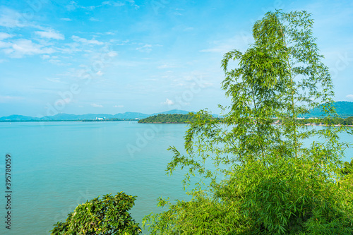 Beautiful tropical sea ocean around island with blue sky and white cloud