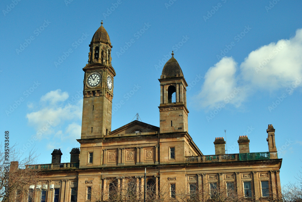 Towers & Clock on Old Victorian Classical Public Building against Blue Sky