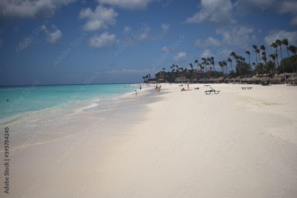 A beautiful place on earth, the whit beach with palmtree and little clouds