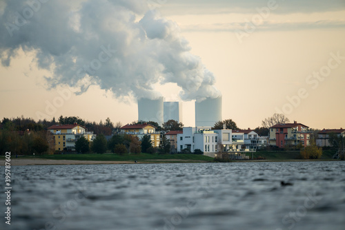 Buildings at the Cospudener Lake in Leipzig, power stations far away in the background © DZiegler