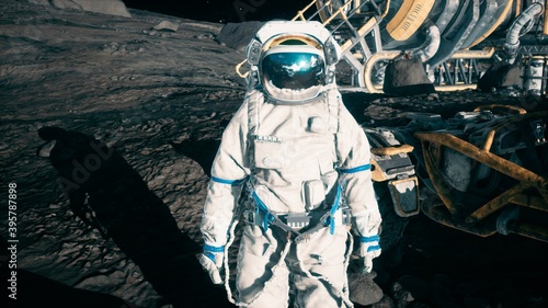 Fototapeta Naklejka Na Ścianę i Meble -  An astronaut stands beside his lunar rover at the space moon base. View of the lunar surface and lunar colony. 3D Rendering.