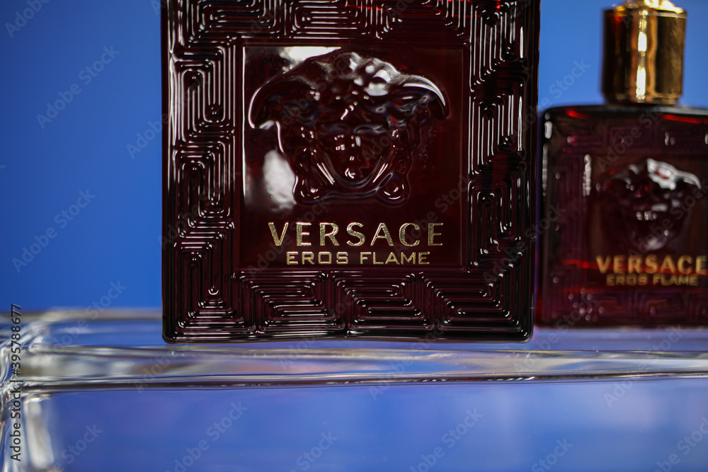 Viersen, Germany - May 9. 2020: Close up of isolated Versace eros flame men  perfume flacon in on glass, blue background Stock Photo | Adobe Stock