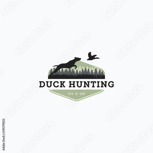 Vector illustration of dog hunt the flying duck good for duck hunting club logo, badge, and sticker design