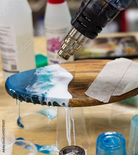 drying paint with a hairdryer on the board
