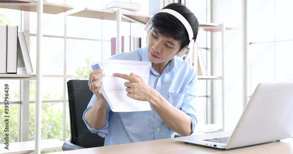 Asian businessman talking to her colleagues about plan in video conference, Online meetings in video calls for business teams, Work from home. Asian businessman talking to her colleagues about plan in video conference, Online meetings in video calls for business teams, Work from home.