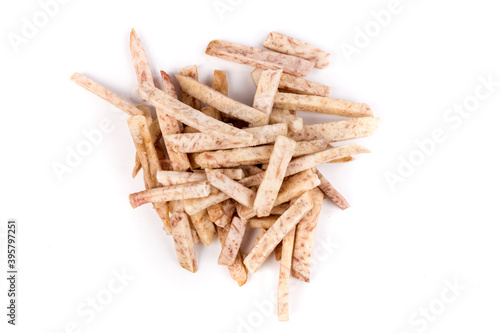 Pile of dehydrated taro snack sticks isolated over white top down view
