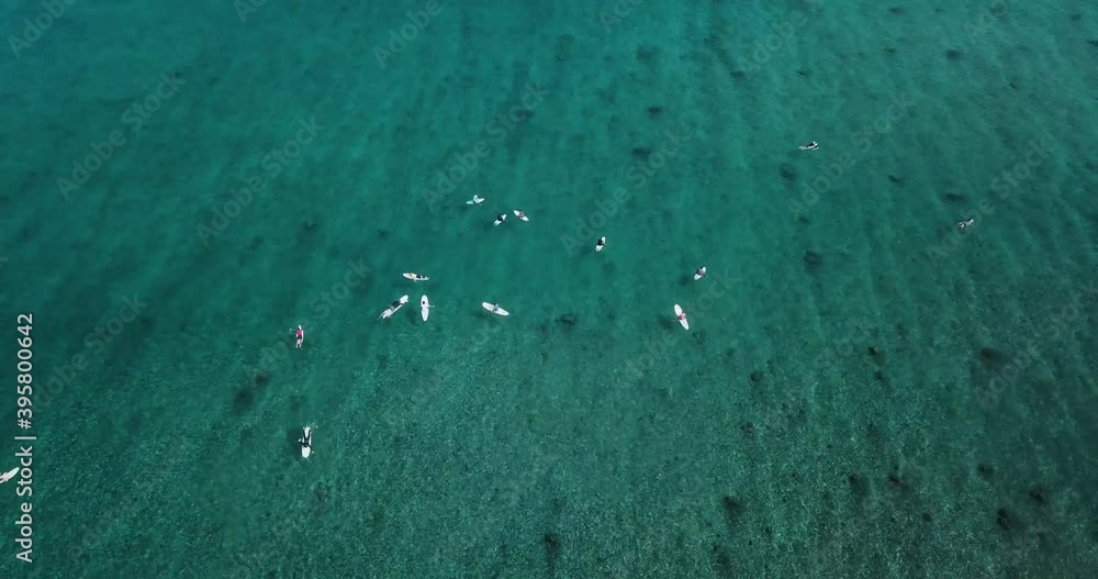Surfers on sea waves, aerial view, Himmafushi island, Maldives. High quality 4k footage Surfers on sea waves, aerial view, Himmafushi island, Maldives. High quality 4k footage