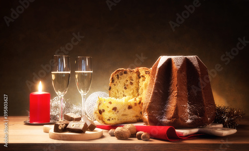 Christmas, with panettone, pandoro and sparkling wine for two, space for text. photo