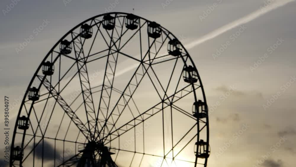 Ferris wheel against the background of the evening sky. Ferris wheel against the background of the evening sky.