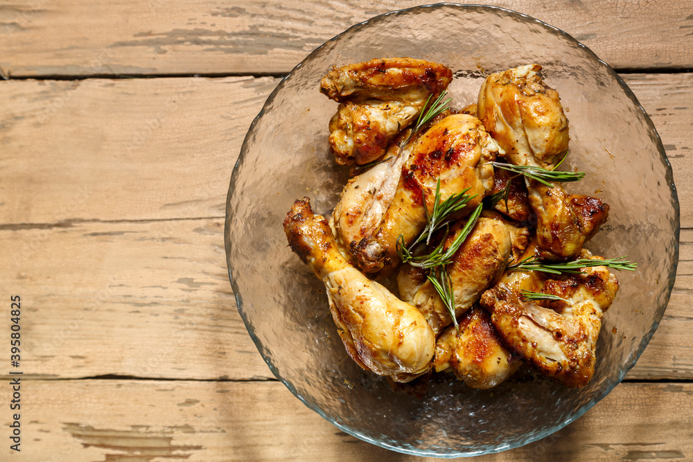 Marinated baked chicken drumsticks and wings in a plate. Marinated baked chicken drumsticks and wings in a plate.