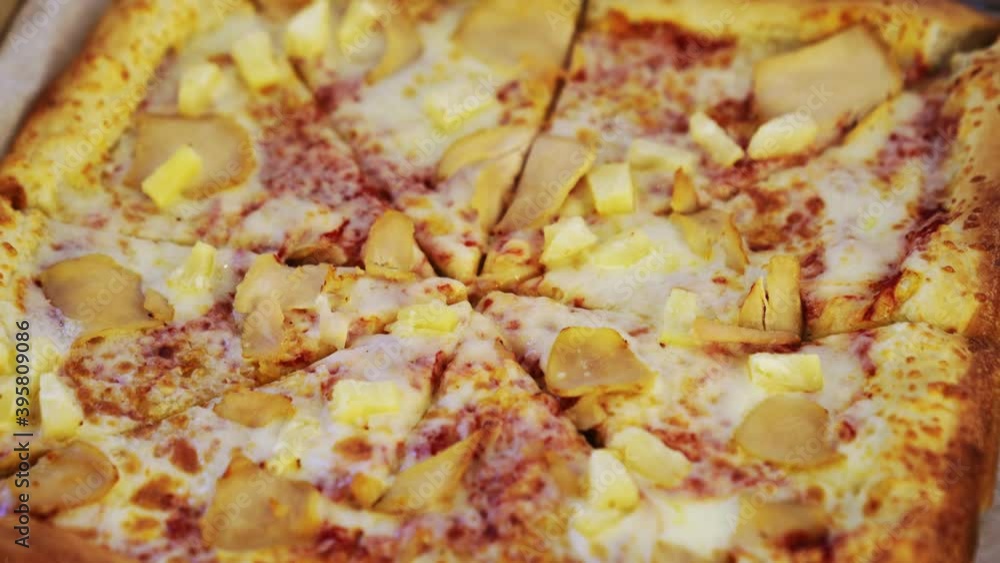 square pizza with chicken and pineapple. snack for the party. square pizza with chicken and pineapple. snack for the party.