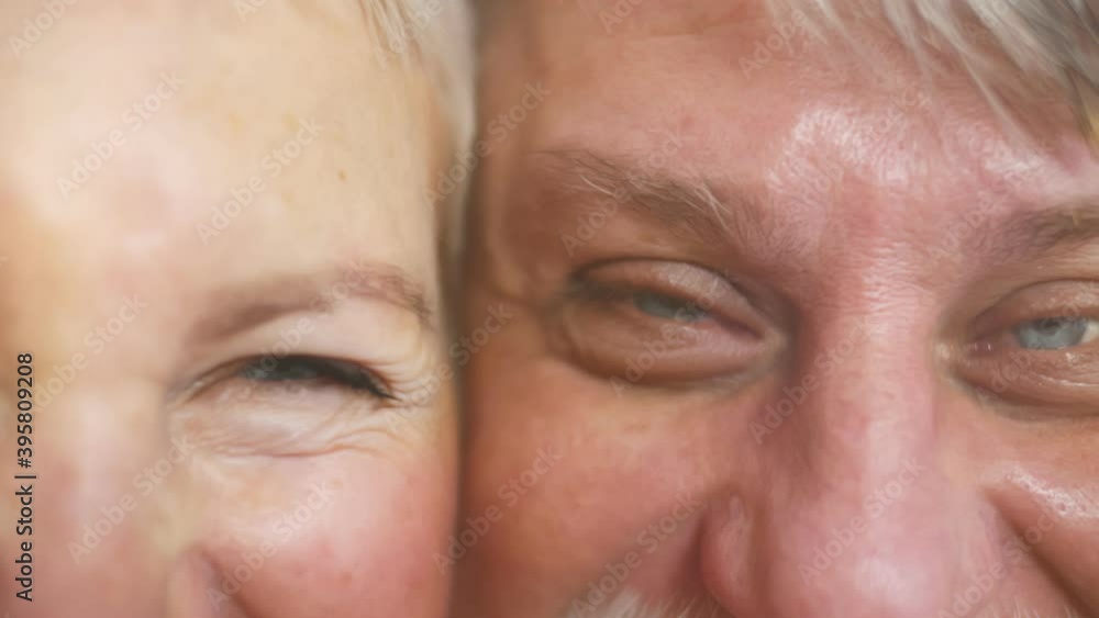 Macro shot of aged man and woman laughing sinisterly Macro shot of aged man and woman laughing sinisterly