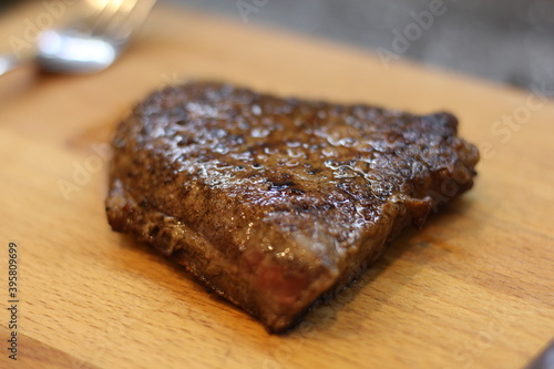 grilled steak on a wooden board