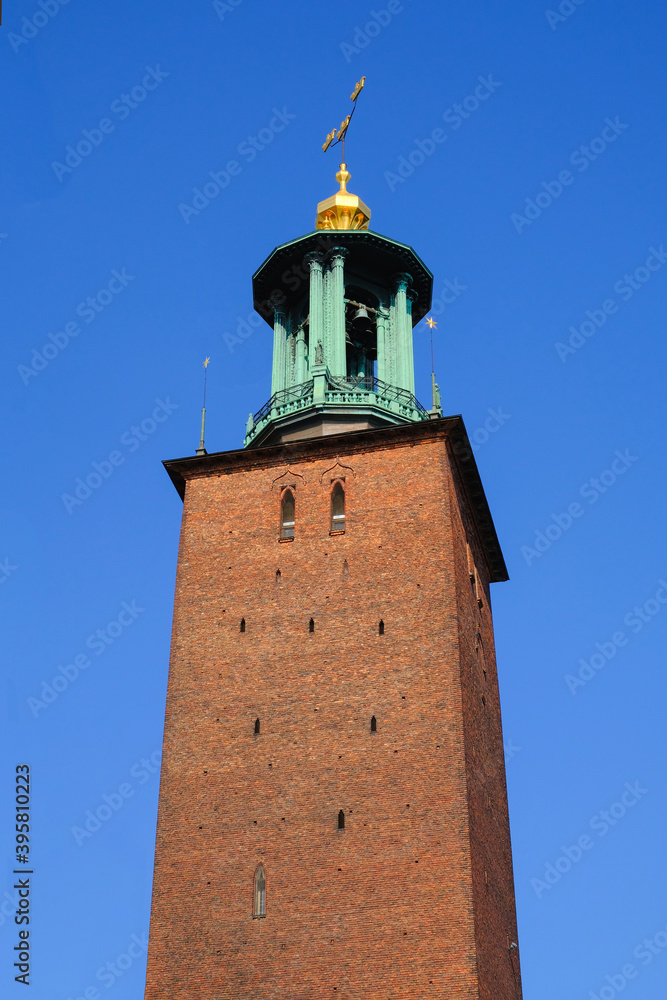Stockholm City Hall tower in sunny day with clear blue sky. Fragment of Stadshuset. Stockholm. Sweden.