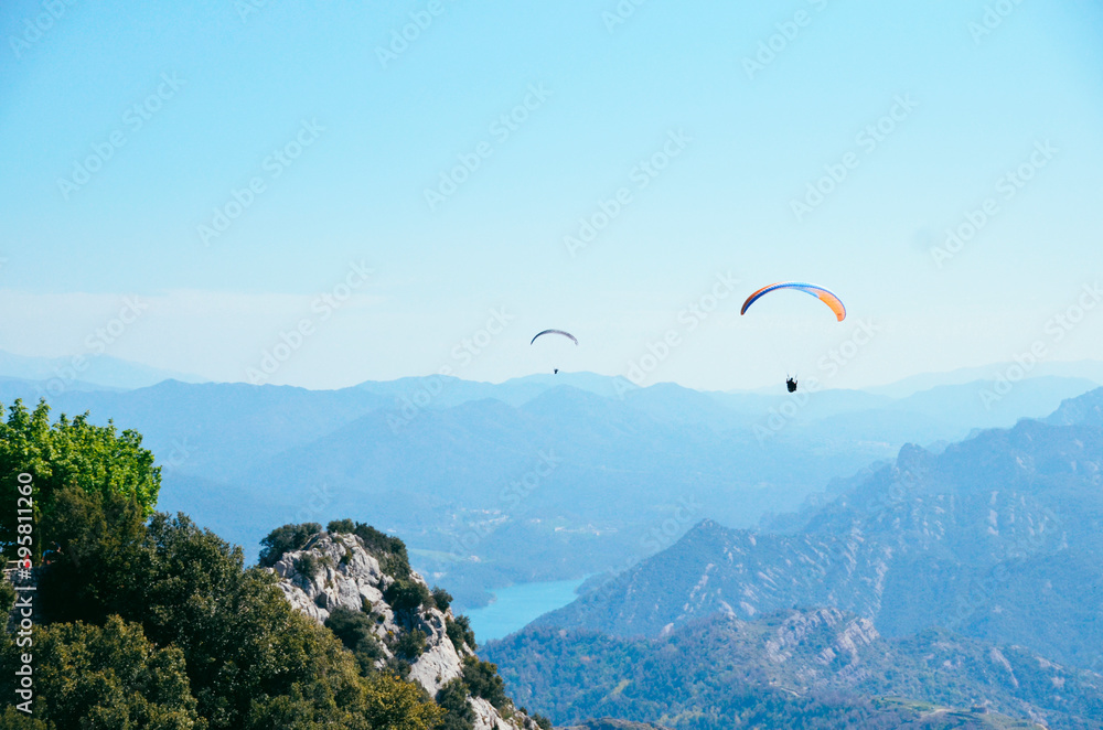 Parachuting flying over mountains Parachuting flying over mountains