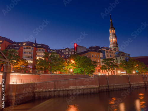 Hamburg City night scene with warm colors during summer time and blue sky background