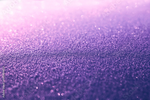 Abstract purple glitter sparkling festive background. 