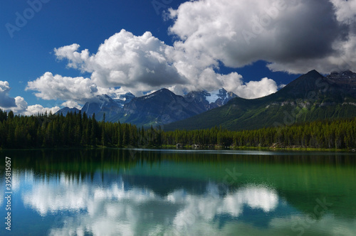Bow Range Peaks and clouds reflected in Herbert Lake © Reimar