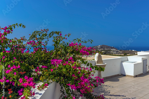 A view from a church courtyard close to the settlement of Akortiri in Santorini in summertime photo