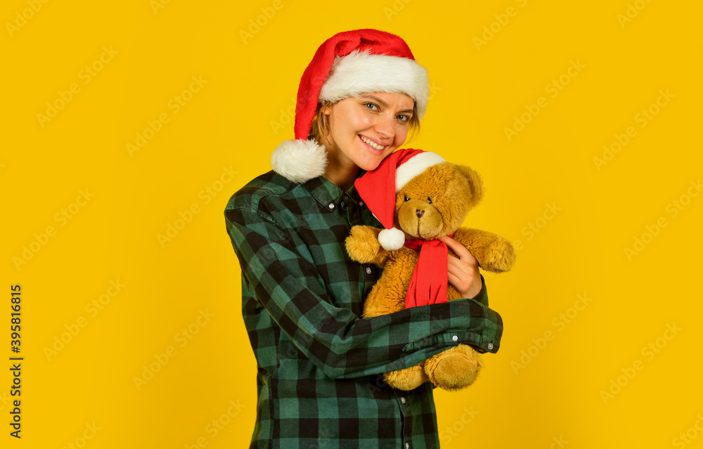 Play with toy. Santa Claus. Pretty woman celebrate christmas. Christmas memories from childhood. Girl with teddy bear. Charity and kindness. Lovely hug. Christmas spirit. Playful lady smiling face Play with toy. Santa Claus. Pretty woman celebrate christmas. Christmas memories from childhood. Girl with teddy bear. Charity and kindness. Lovely hug. Christmas spirit. Playful lady smiling face