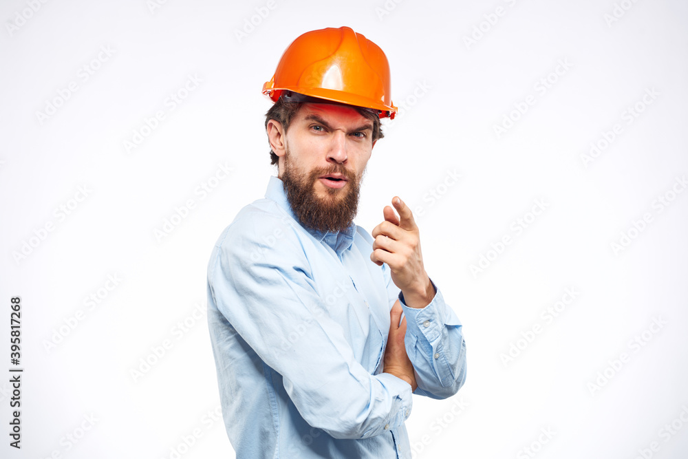 Engineers shirt orange hard hat construction lifestyle emotions cropped view light background Engineers shirt orange hard hat construction lifestyle emotions cropped view light background