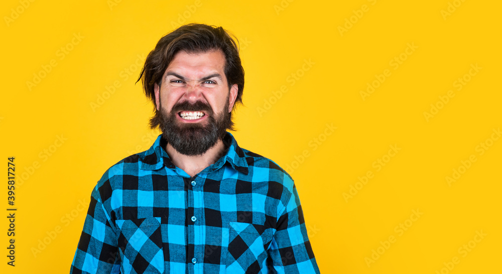 angry male with beard show teeth expressing anger, negative emotions angry male with beard show teeth expressing anger, negative emotions